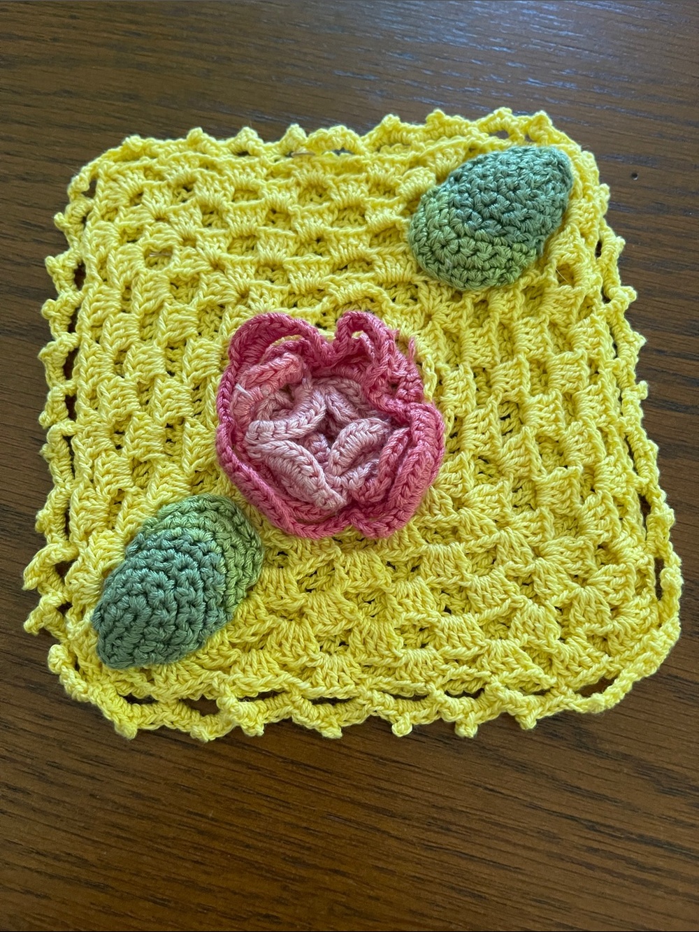 Hand Crafted Yellow Crochet Dishcloth with Pink Flower and Green Accents
